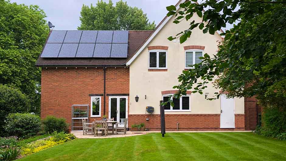 A country side house with solar panels on its roof