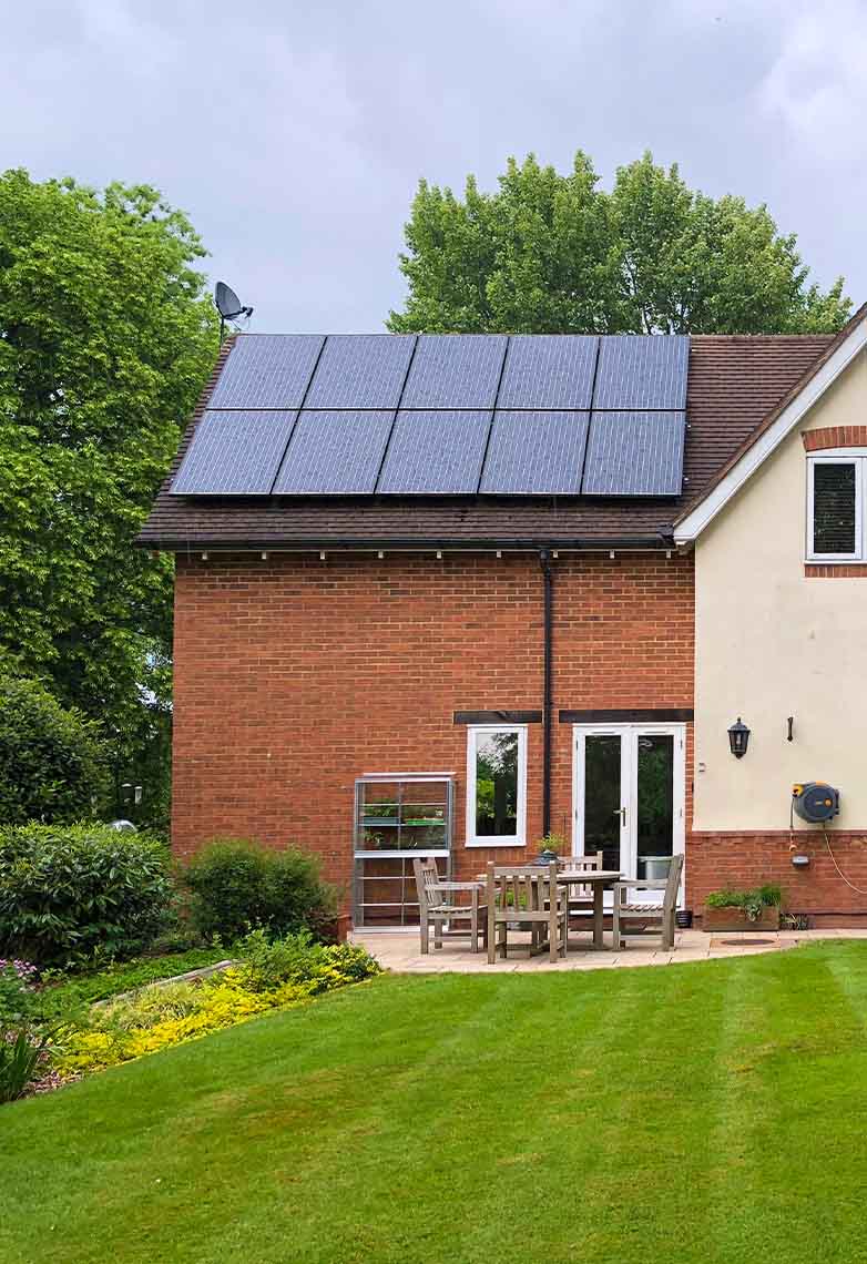 A country side house with solar panels on its roof